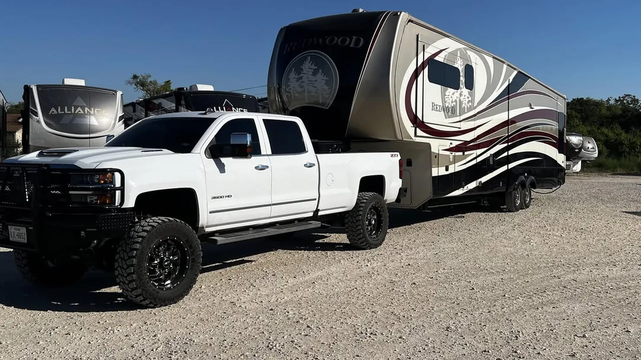 Fifth wheel hitched to a pickup outside the shop, mobile RV repair