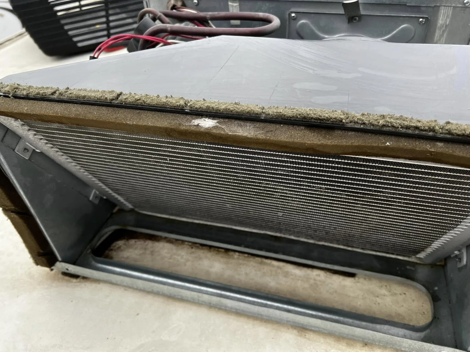 Evaporator coil of a rooftop RV air conditioner during service, RV AC repair