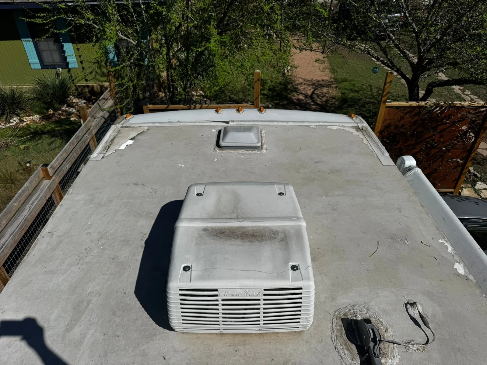 Rooftop RV air conditioner on a freshly resealed RV roof, RV AC repair