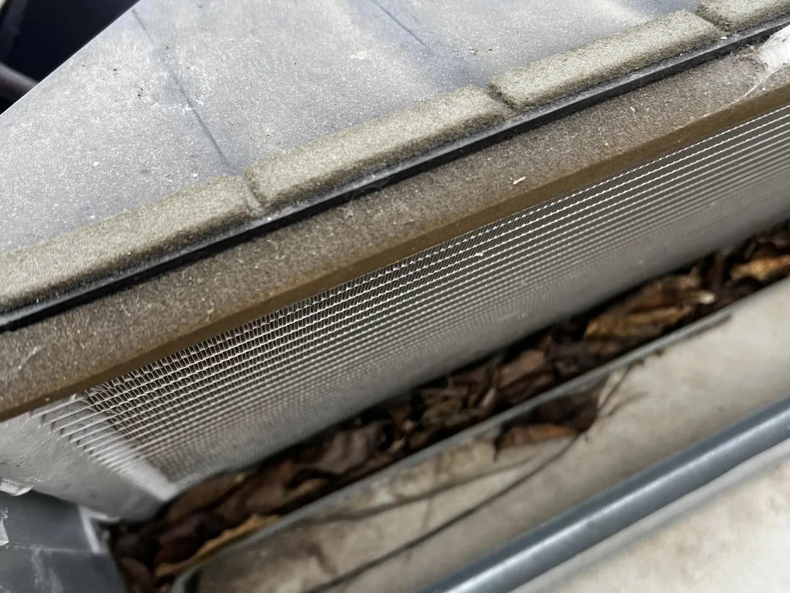 Rooftop RV air conditioner with its shroud off showing the coils, RV AC repair