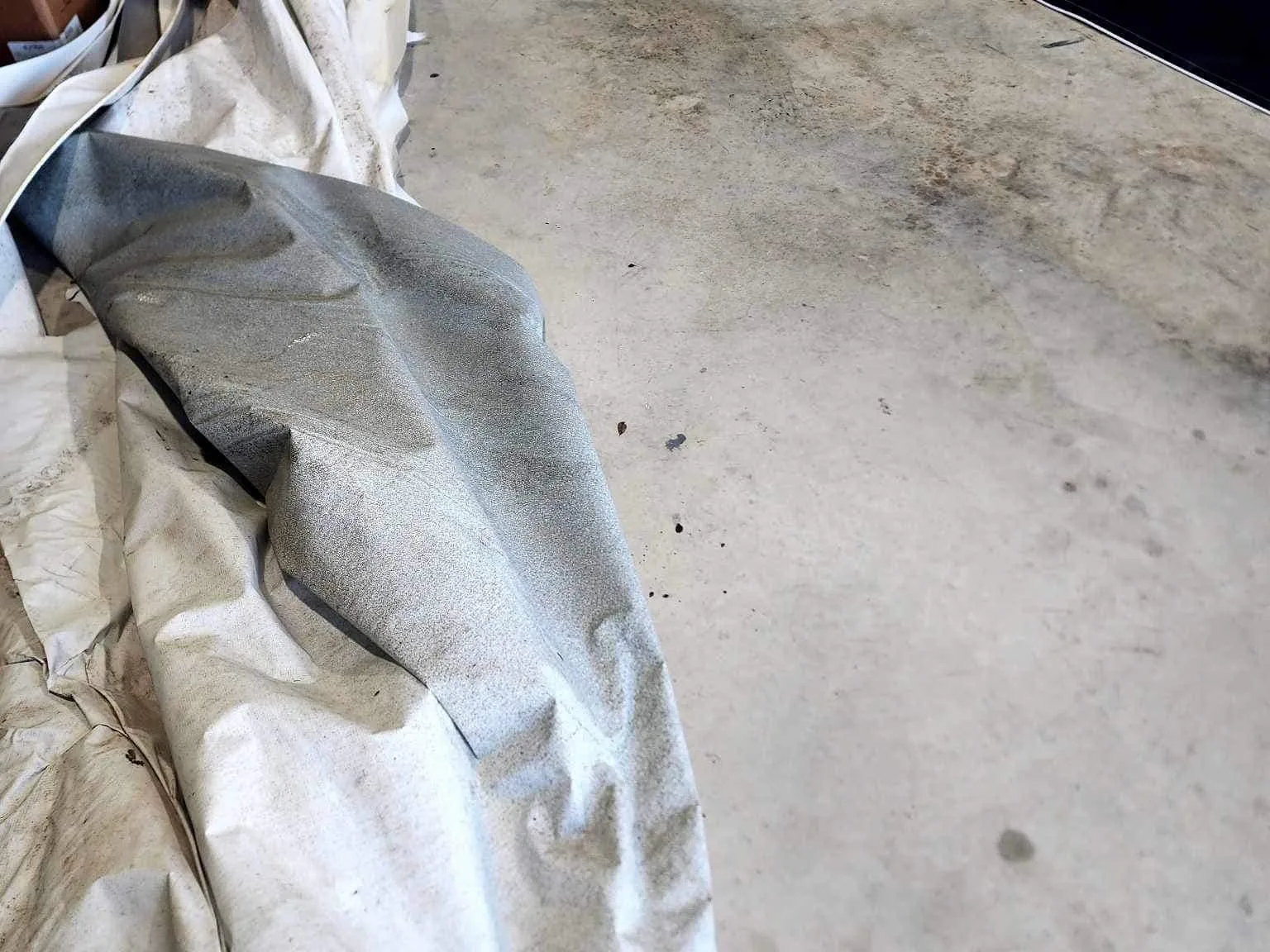 Old sun damaged awning fabric removed from a travel trailer, RV awning repair and replacement