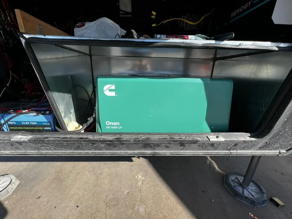 Onboard RV generator in its compartment during an install, RV electrical and generator repair