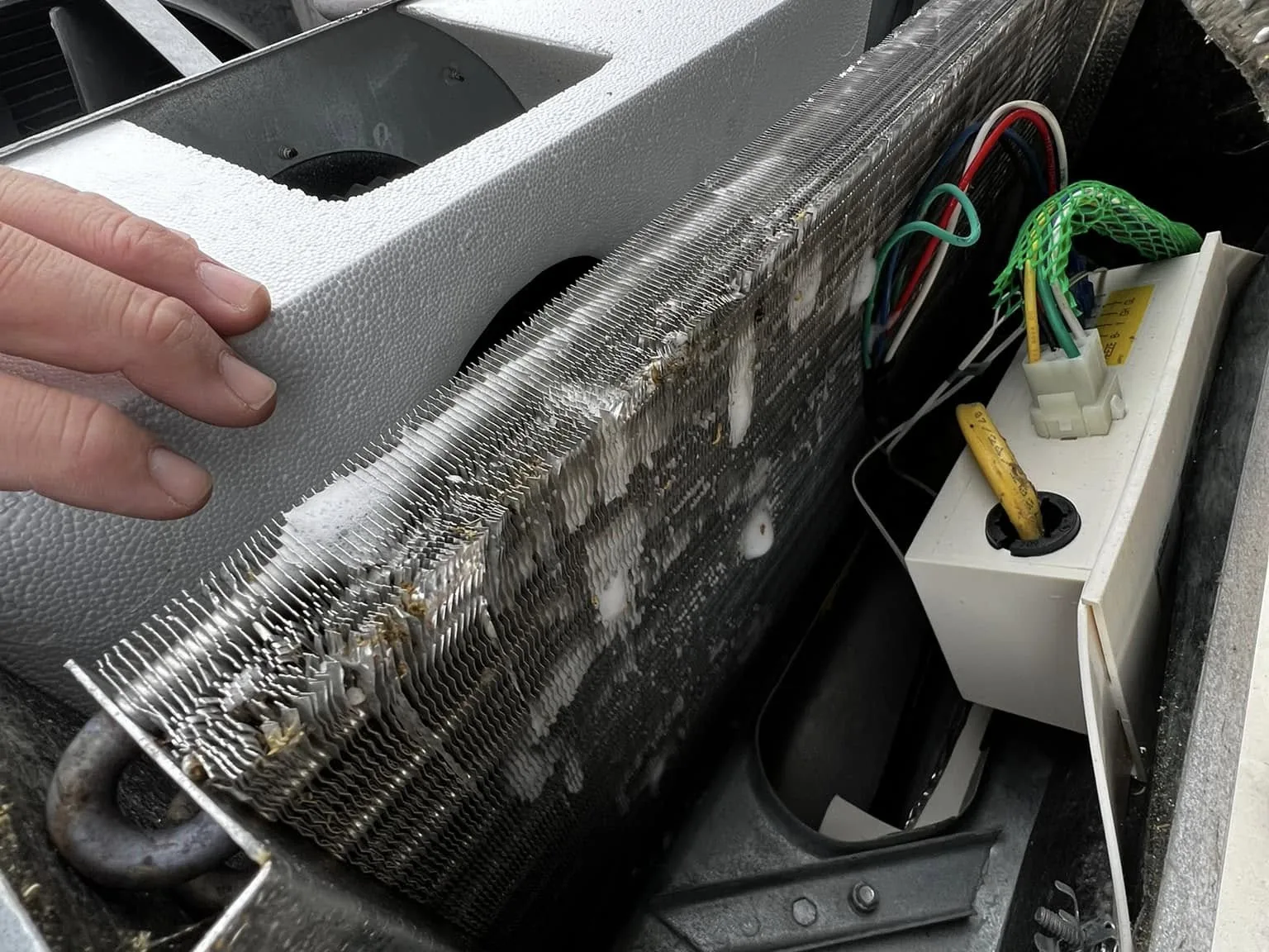 Rooftop RV air conditioner opened for its yearly service, RV maintenance