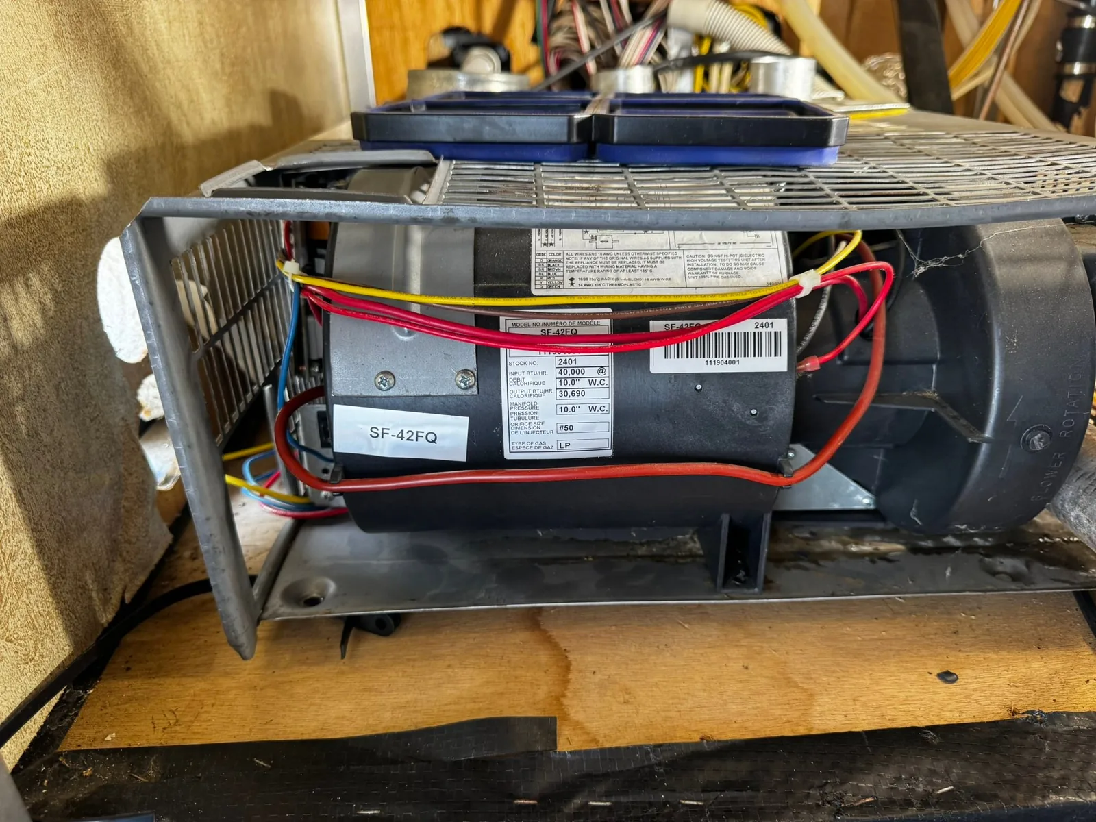 RV furnace pulled for service on the bench, RV propane system service
