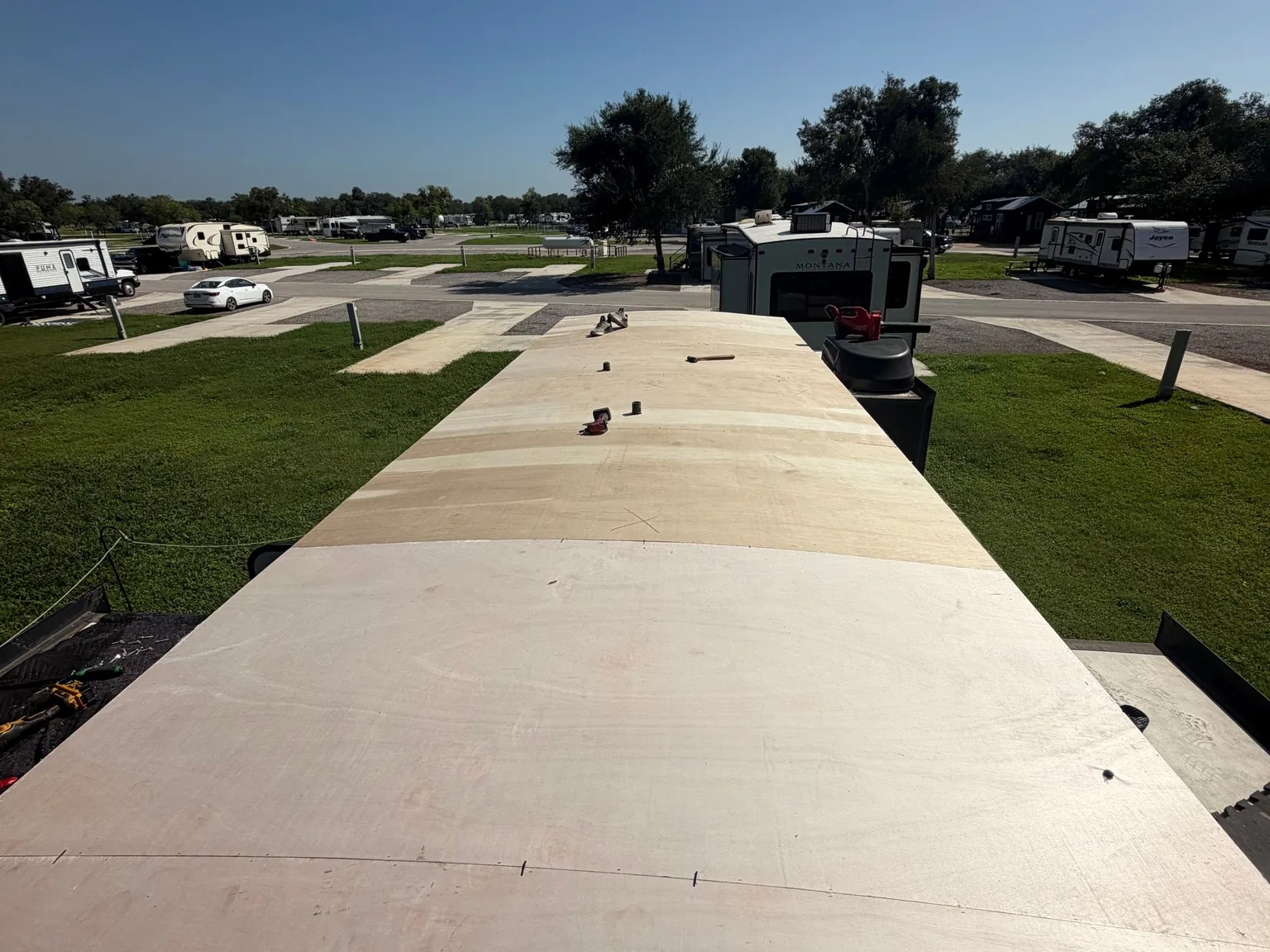 New white roof membrane on a travel trailer, RV roof repair
