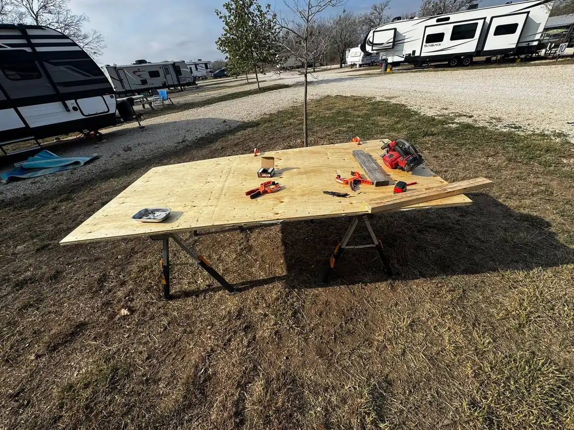 New plywood slide out floor cut on sawhorses at an RV park, RV slide out repair