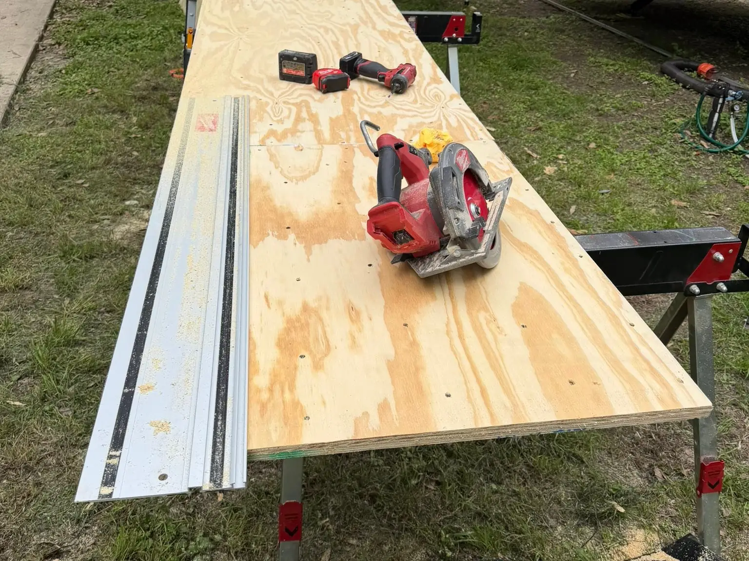 Plywood cut for a new slide out floor beside the trailer, RV slide out repair