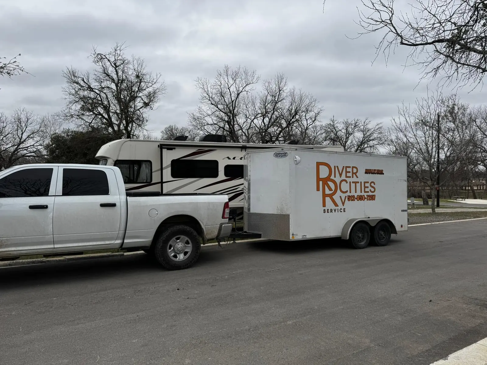 River Cities RV Service truck and trailer on the road to a job, RV suspension repair