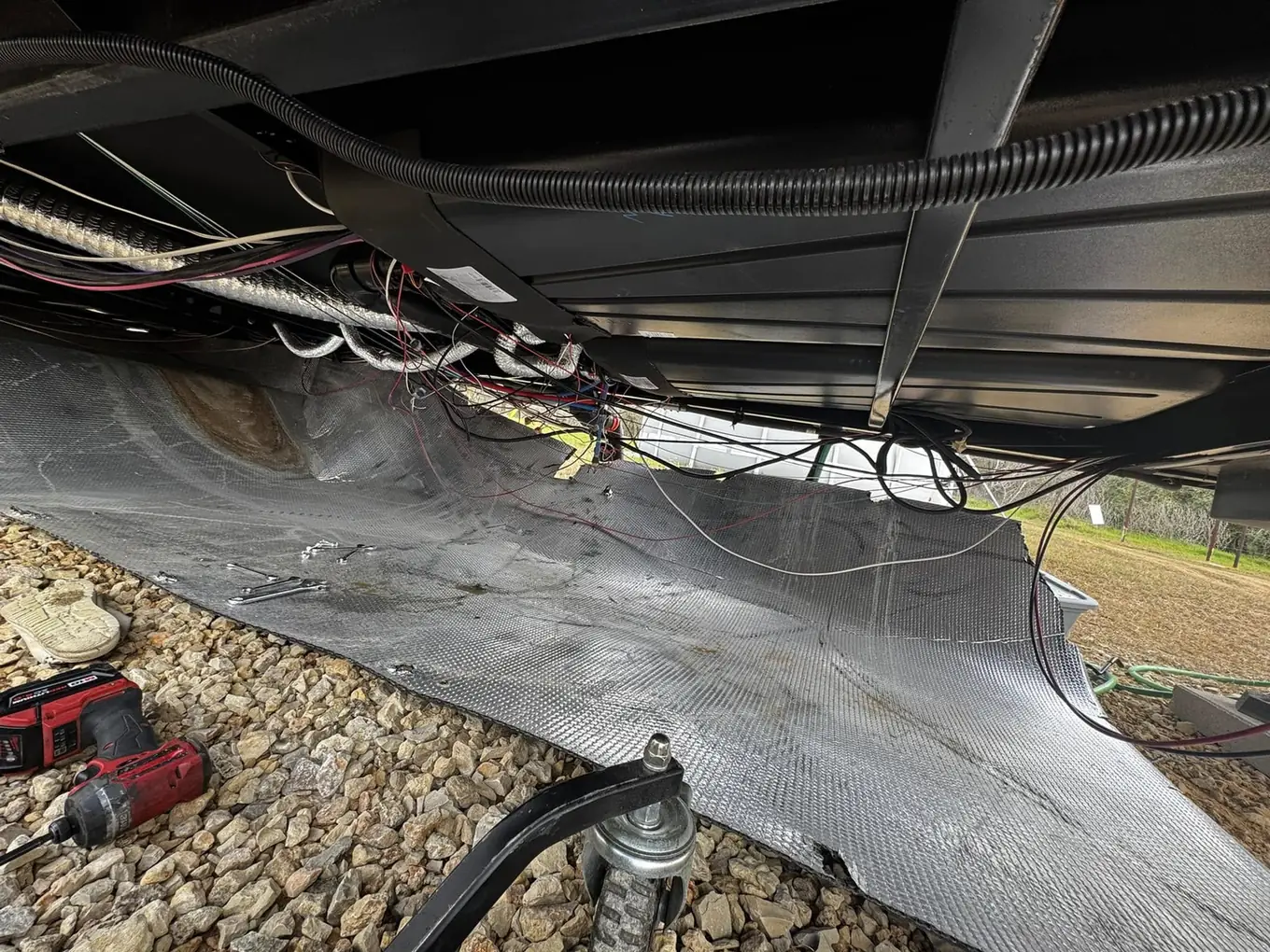 Underside of a fifth wheel during a repair, RV suspension repair