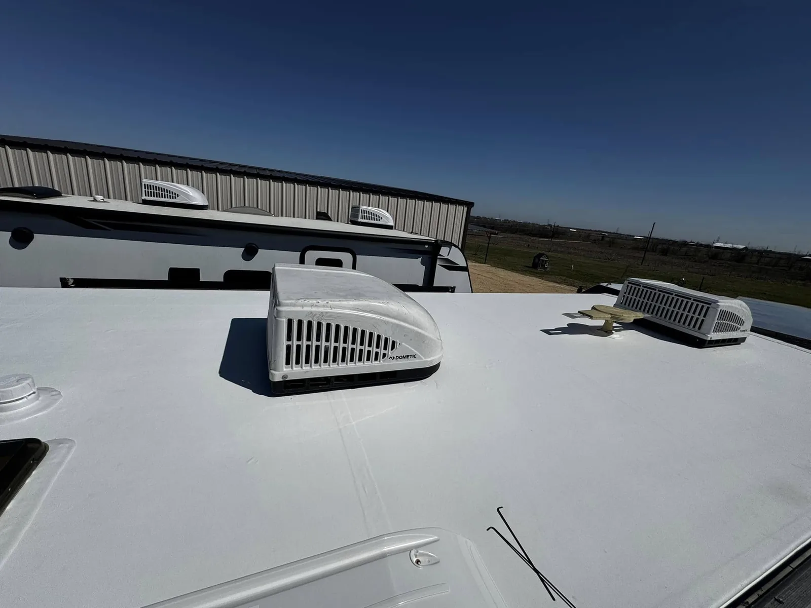 New RV roof and vents after a tree limb damage insurance repair, RV warranty and insurance repairs